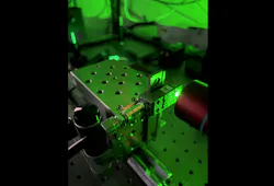 FIGURE 4. One of the group’s microlasers under optical pumping—the middle cavity/bright region is 20 × 15 µm. FIGURE 4. One of the group’s microlasers under optical pumping—the middle cavity/bright region is 20 × 15 µm.