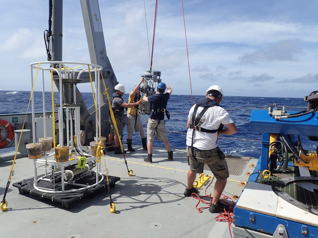 Woods Hole Oceanographic Institution scientists aboard the Schmidt Ocean Institutersquos RV Falkor prepare to lower the rosette responsible for collecting microbes in deadzone regions