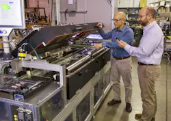 At the Pensar Otra Vez facility, D2 Engineering’s Dan Distefano (left) and Beckhoff’s Regional Sales Engineer inspect the redesigned PCB handler for conducting tests. At the Pensar Otra Vez facility, D2 Engineering’s Dan Distefano (left) and Beckhoff’s Regional Sales Engineer inspect the redesigned PCB handler for conducting tests.