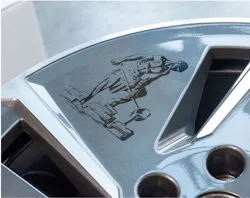 Laser processing combined with automated part handling lets companies mark parts such as this automotive wheel with intricate designs. Laser processing combined with automated part handling lets companies mark parts such as this automotive wheel with intricate designs.