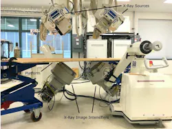 3. Test and verification: Two X-ray sources above and two X-ray image intensifiers below were used to collect stereo X-ray video of the radio-opaque magnetic beads in the turkey leg. A platform was placed between the X-ray sources and image intensifiers for the turkey to rest on and on which to mount the motor and spring. 3. Test and verification: Two X-ray sources above and two X-ray image intensifiers below were used to collect stereo X-ray video of the radio-opaque magnetic beads in the turkey leg. A platform was placed between the X-ray sources and image intensifiers for the turkey to rest on and on which to mount the motor and spring.