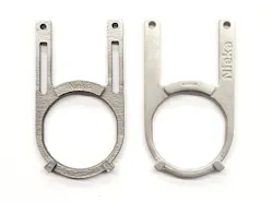 The crucible clip 3D printed using DMLS (left) and FFF (right). The crucible clip 3D printed using DMLS (left) and FFF (right).