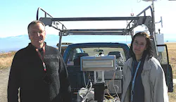 A prototype LightSlinger antenna is flanked by Los Alamos researchers John Singleton and Andrea Schmidt at Los Alamos airport where it was tested and successfully transmitted high-fidelity music. A prototype LightSlinger antenna is flanked by Los Alamos researchers John Singleton and Andrea Schmidt at Los Alamos airport where it was tested and successfully transmitted high-fidelity music.
