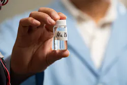 A vial of clear, sodium-ion electrolyte, which was developed to keep the energy flowing through an experimental battery technology. A vial of clear, sodium-ion electrolyte, which was developed to keep the energy flowing through an experimental battery technology.