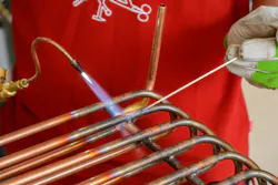 Worker engaged in brazing Worker engaged in brazing