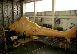 Cortec Corporation has a number of corrosion prevention solutions for military readiness. Featured here is a helicopter wrapped in MilCorr FR VpCI Shrink Film, a heavy-duty film featuring Cortec multimetal Vapor phase Corrosion Inhibitors (VCI), flame retardant additives, and UV (ultraviolet) inhibitors. The material is designed to maintain the integrity of the film itself as well as the parts packaged within. Cortec Corporation has a number of corrosion prevention solutions for military readiness. Featured here is a helicopter wrapped in MilCorr FR VpCI Shrink Film, a heavy-duty film featuring Cortec multimetal Vapor phase Corrosion Inhibitors (VCI), flame retardant additives, and UV (ultraviolet) inhibitors. The material is designed to maintain the integrity of the film itself as well as the parts packaged within.