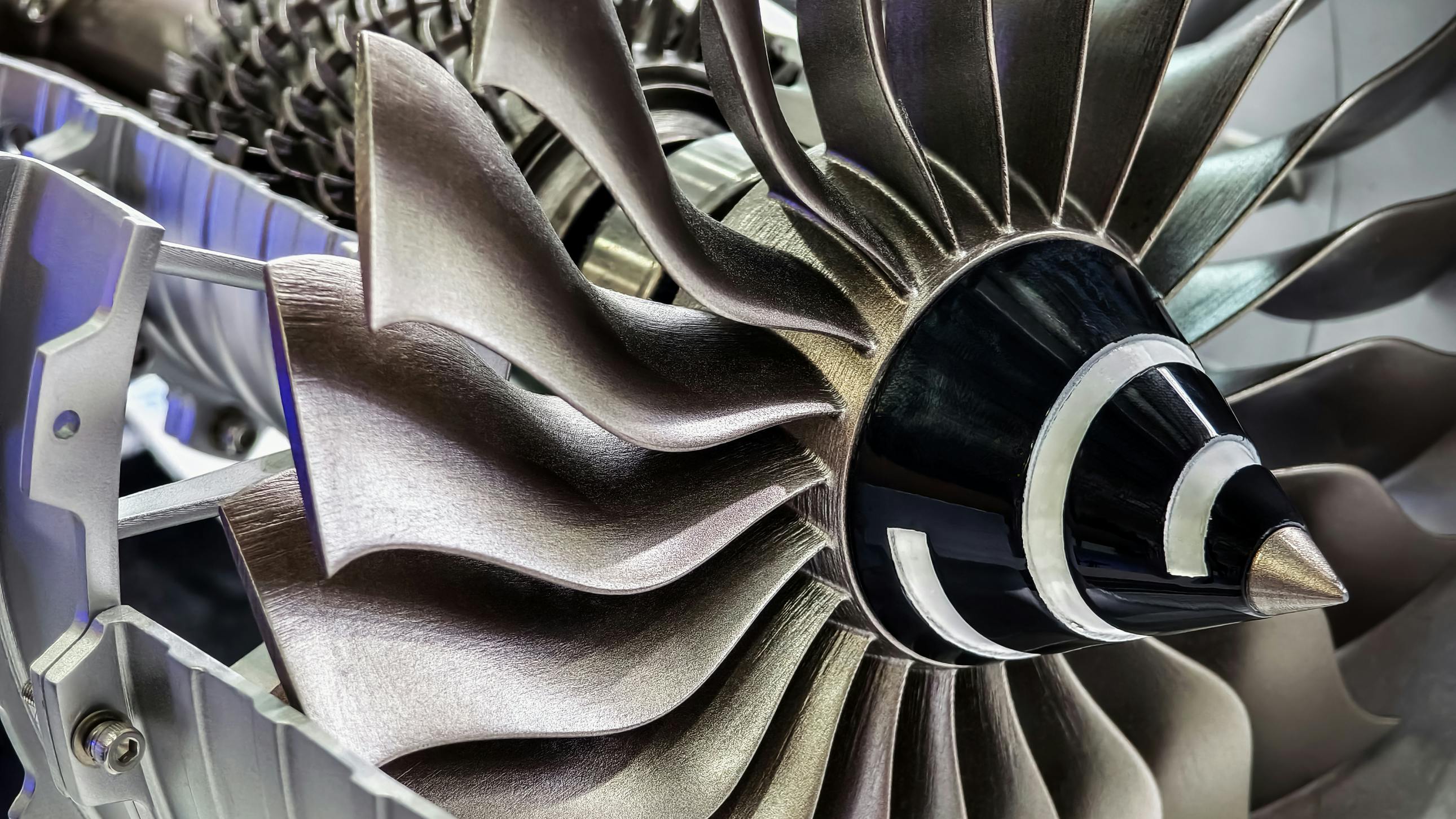 Producing complex aerospace parts, like the turbine blades on this jet engine, requires a hybrid approach, combining additive manufacturing&rsquo;s design freedom with the tight tolerances, controlled surface finishes and consistent geometric accuracy that subtractive manufacturing (e.g., CNC) provides.