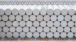 Pile of many precast spun micropiles construction material stacked on the floor in industry yard area for building foundation work. Concrete cylinder micropile background. Pile of many precast spun micropiles construction material stacked on the floor in industry yard area for building foundation work. Concrete cylinder micropile background.