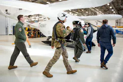 U.S. Air Force and BETA technologies team members walk toward an ALIA aircraft for a test flight. U.S. Air Force and BETA technologies team members walk toward an ALIA aircraft for a test flight.