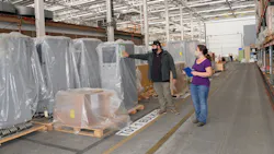 Naval Information Warfare Center Pacific’s warehouse manager Paul Cox and lead logistician Sara Singer-Seviern inventory outbound information systems equipment. Naval Information Warfare Center Pacific’s warehouse manager Paul Cox and lead logistician Sara Singer-Seviern inventory outbound information systems equipment.