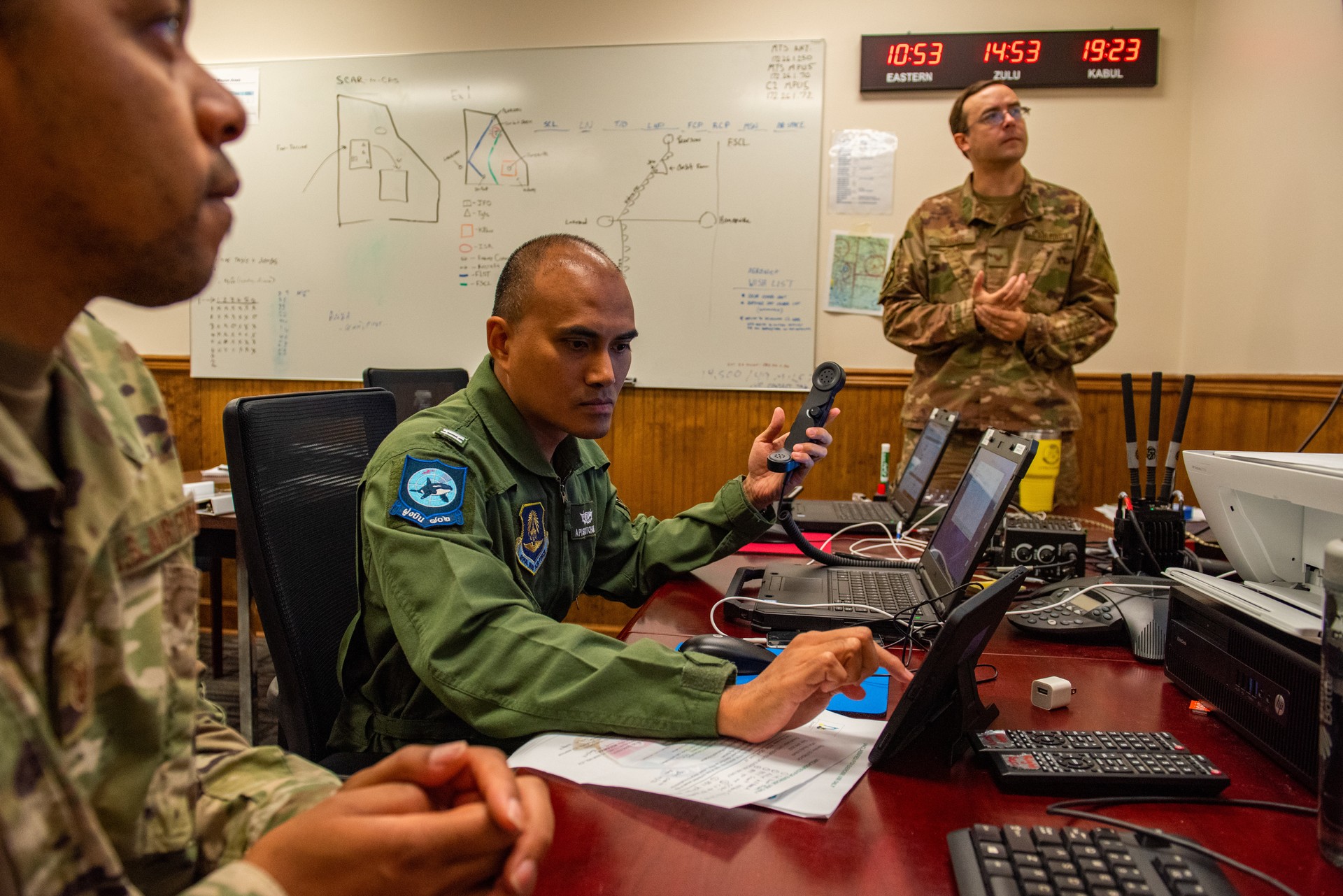 U.S. Air Force mobile data manager, supervises Airborne Extensible Relay Over-Horizon Network integration for Royal Thai Air Force Flying Officer Apisit Kitchoke at Moody Air Force Base, Ga.