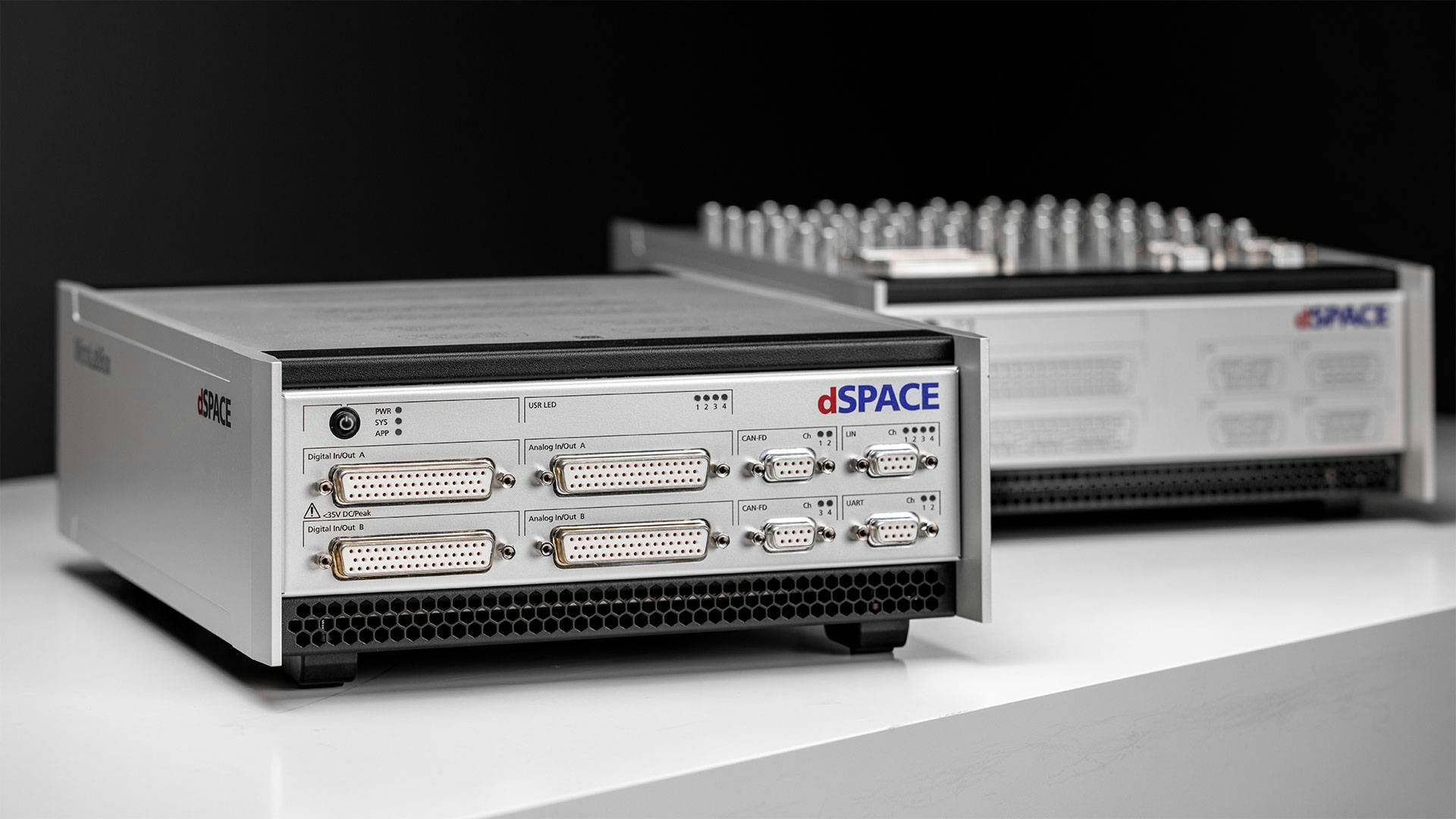The MicroLabBox II is available in a front-panel version and a top-panel version.