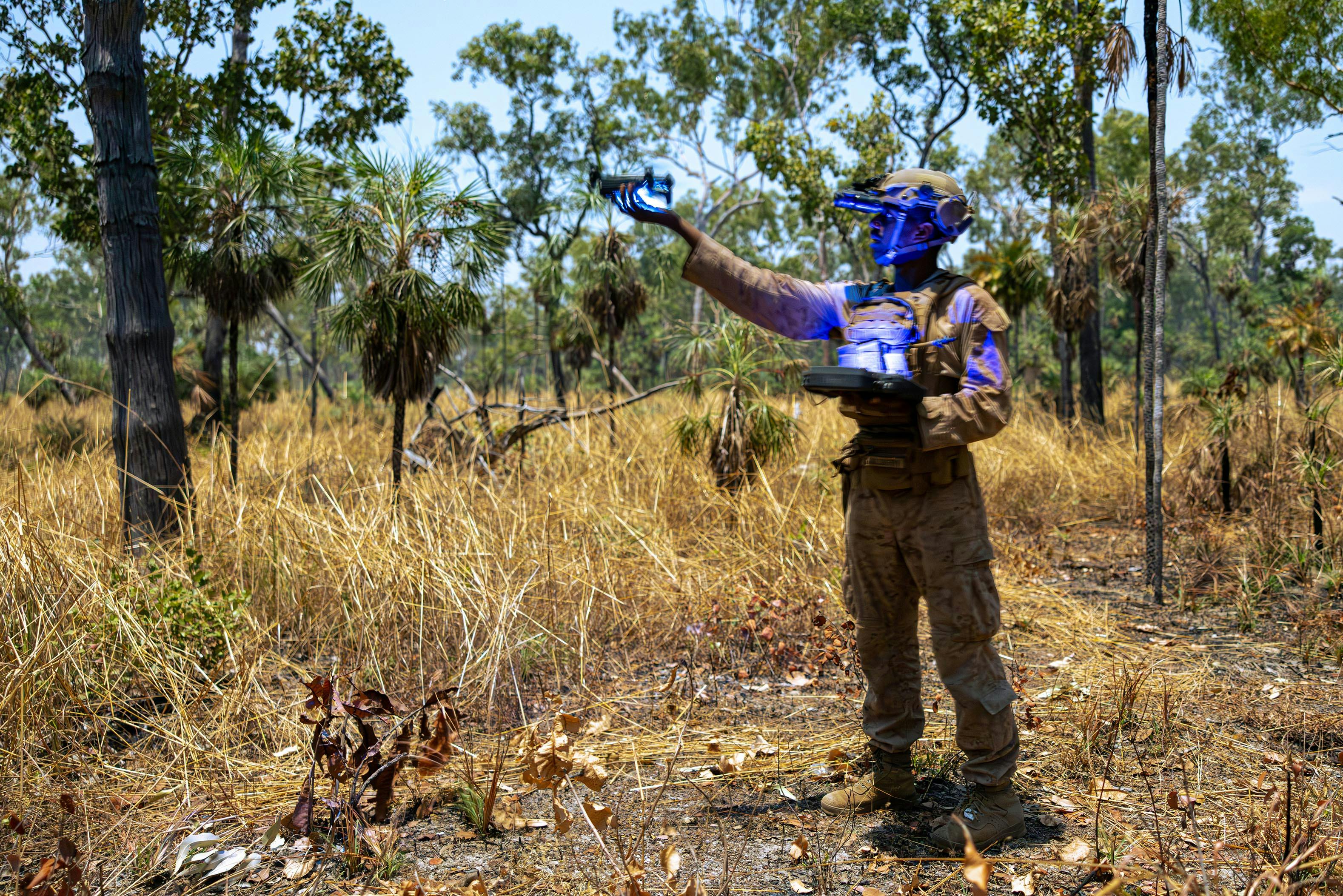 A U.S. Marine Corps technician uses artificial intelligence to fly an unmanned aircraft system during a squad attack range as a part of an exercise in Australia earlier this year. Marine Corps photo