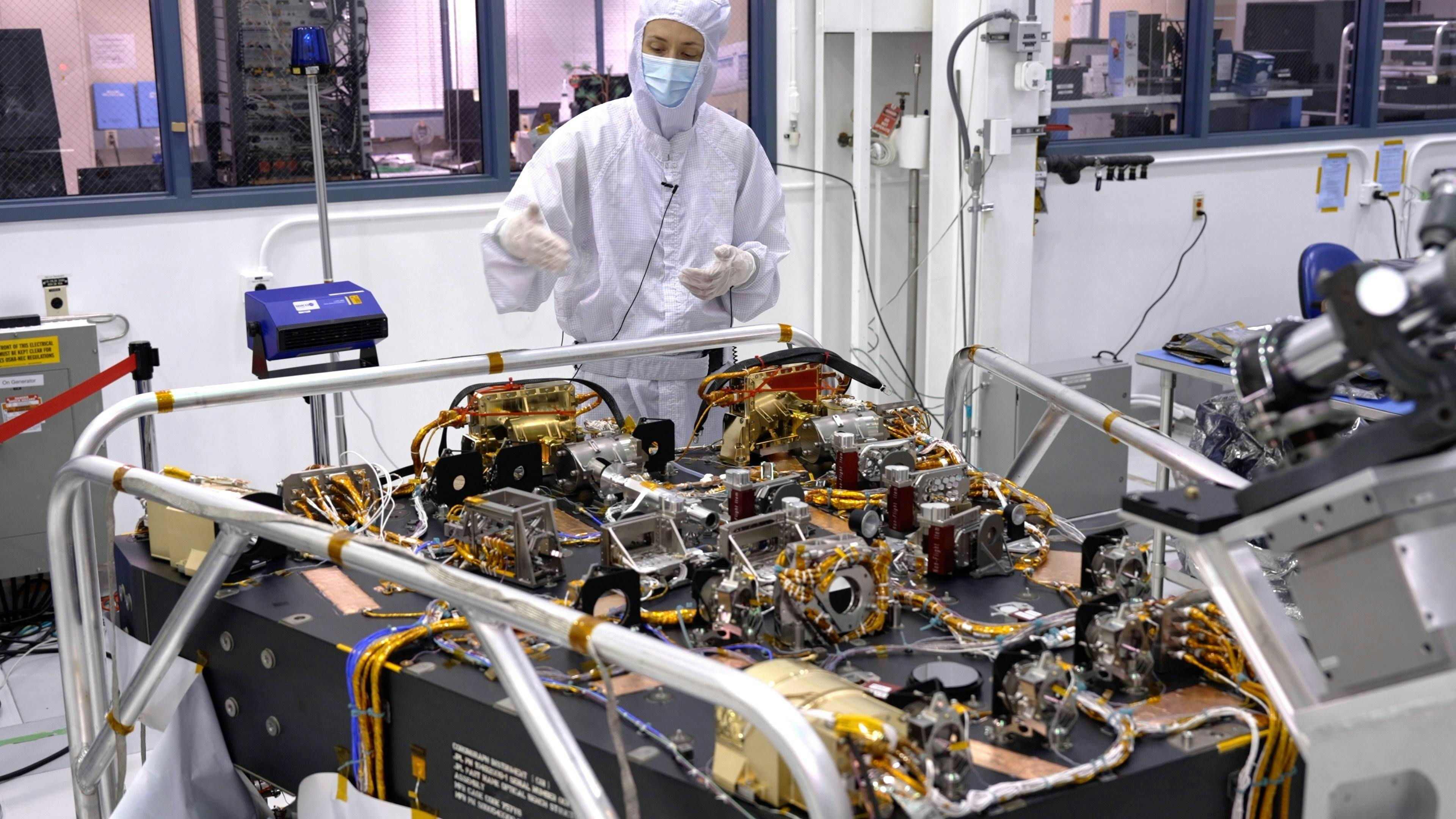 In a clean room at NASA&rsquo;s Jet Propulsion Laboratory in Southern California in October 2023, scientist Vanessa Bailey stands behind the Roman Coronagraph, which has been undergoing testing at the lab. Designed to block starlight and allow scientists to see the faint light from planets outside our solar system, the Coronagraph is a technology demonstration that will be part of the Roman telescope. NASA/JPL-Caltech photo.