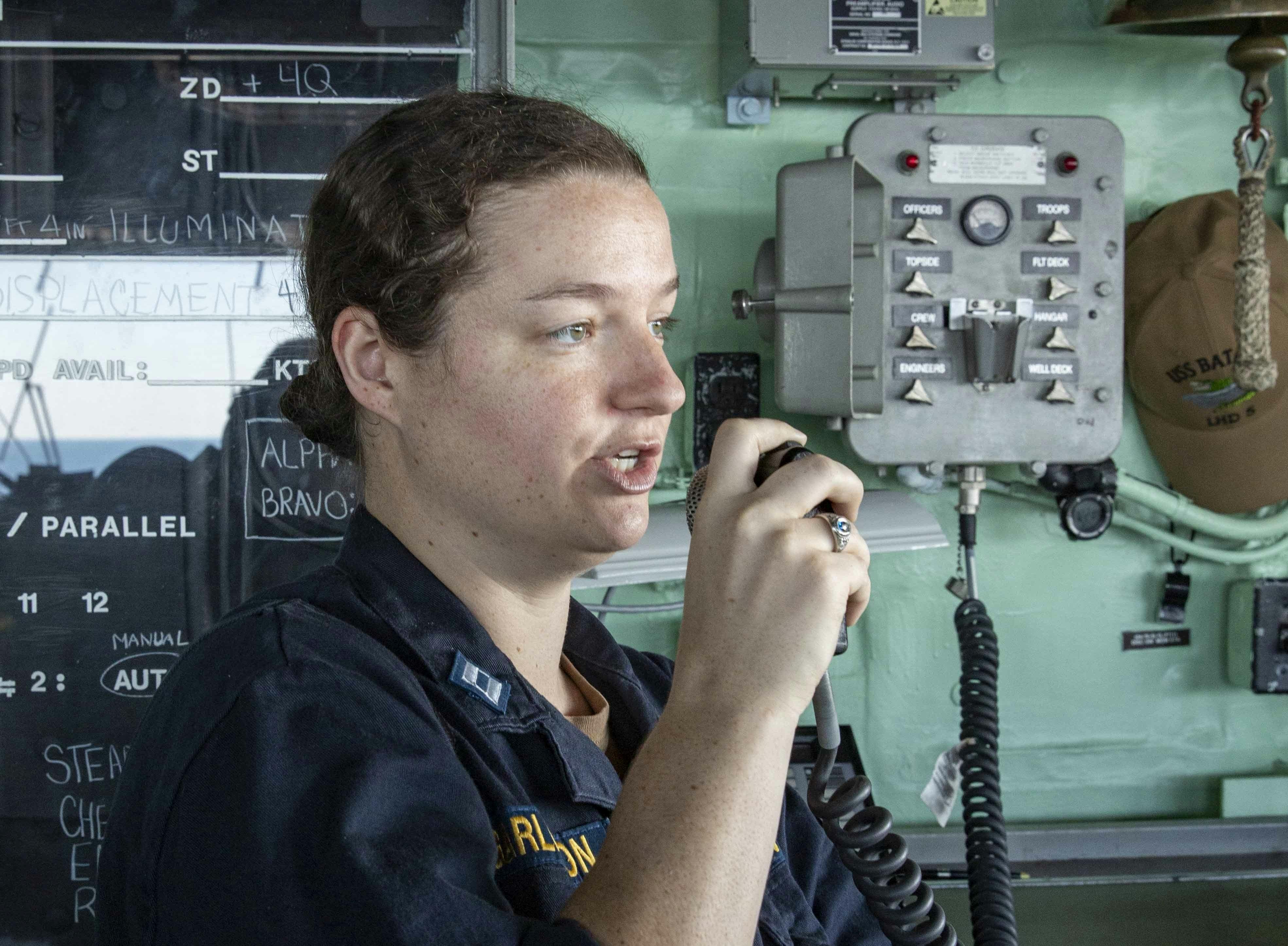 A Navy communications expert sends messages while aboard the amphibious assault ship USS Bataan (LHD 5) during an exercise in 2019.
