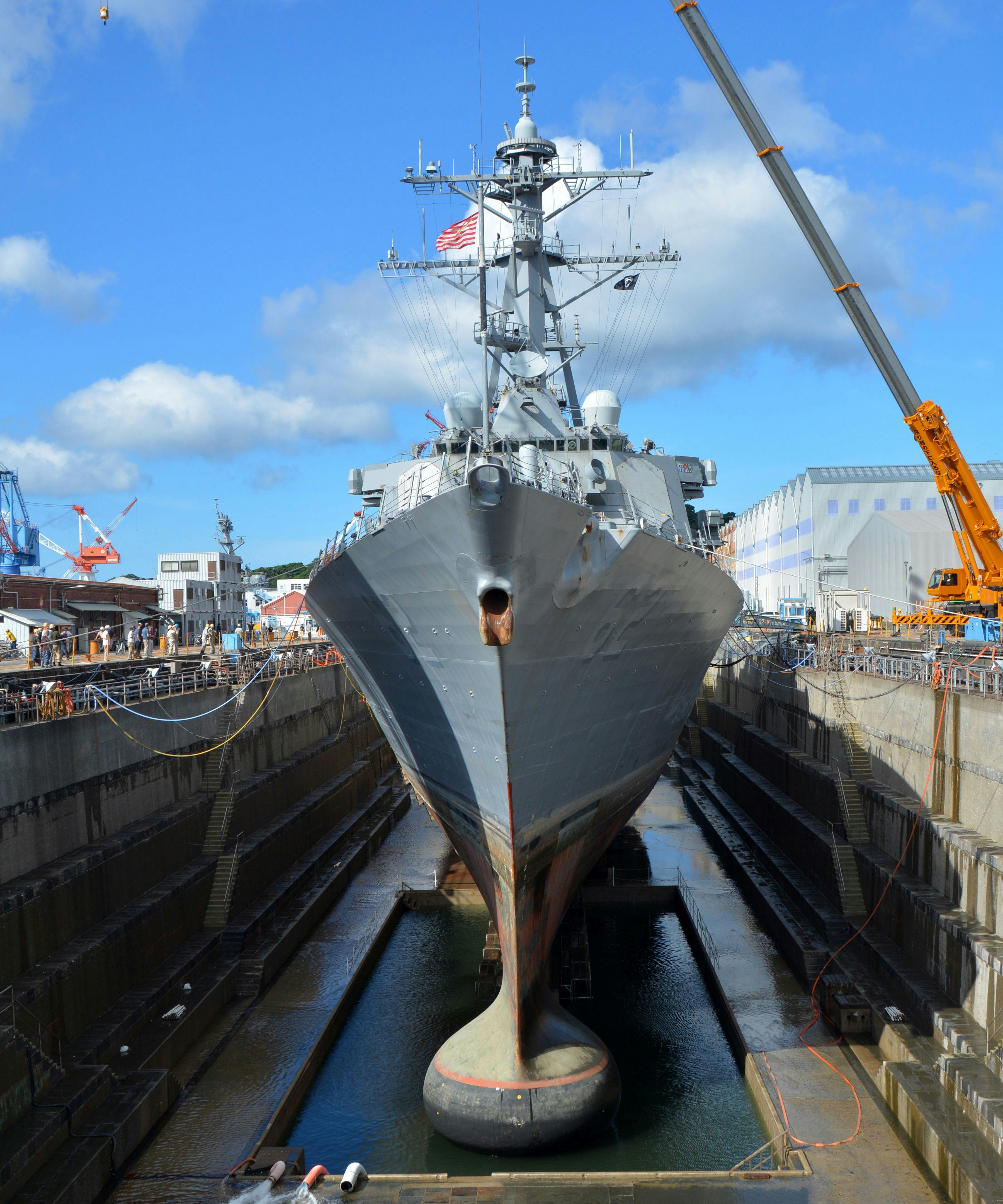 The Arleigh Burke-class guided-missile destroyer USS Fitzgerald (DDG 62) sits in dry dock in Yokosuka, Japan. The TR-343 transducer is part of the AN/SQS-53C hull mounted sonar shown at the bow of the ship.