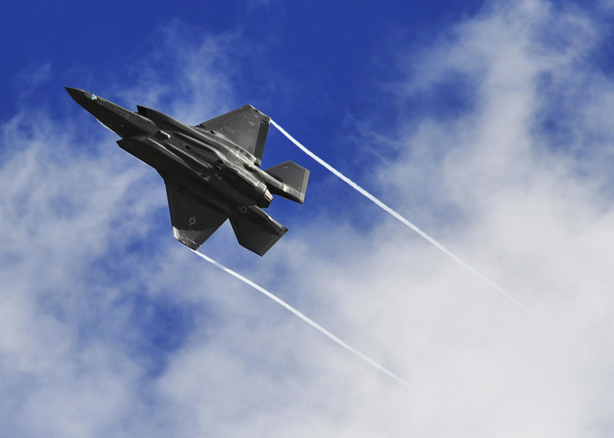 An F-35 Lightning II performs a maneuver over Luke Air Force Base, Ariz.