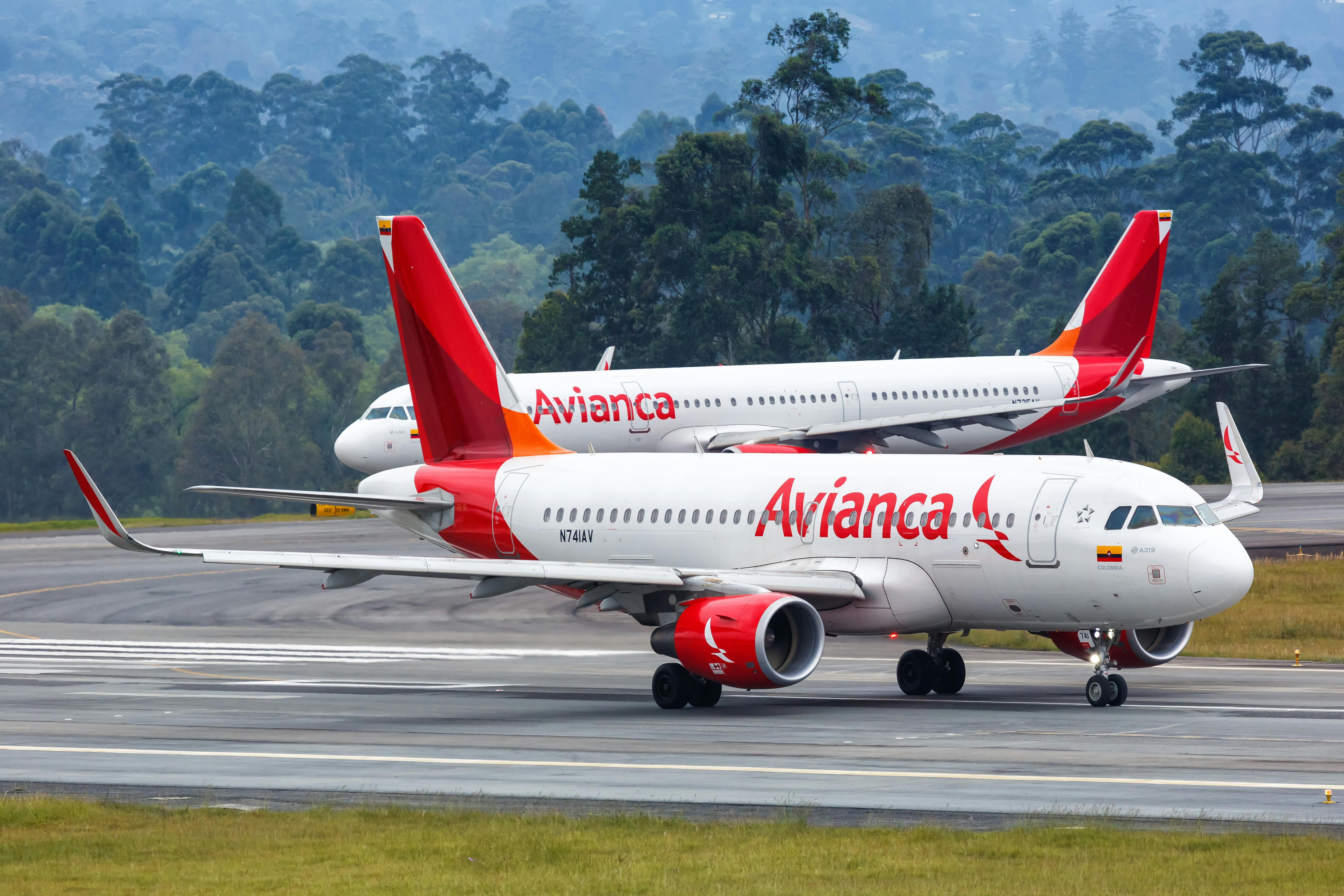 Two Avianca aircraft on the taxiway.