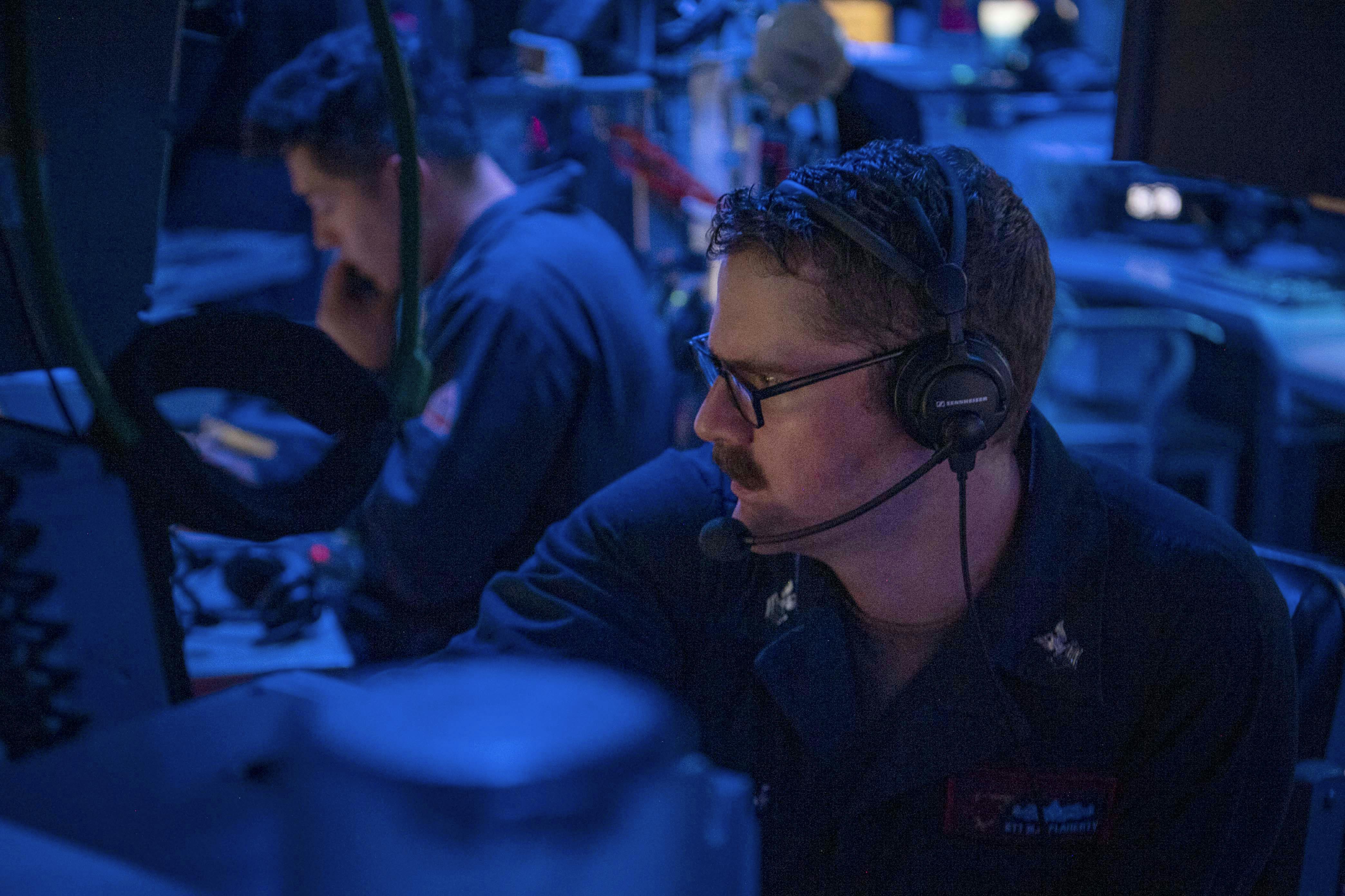A Navy electronics technician stands watch in the combat information center aboard the Arleigh Burke-class guided-missile destroyer USS Sterett (DDG 104) in the South China Sea earlier this month.
