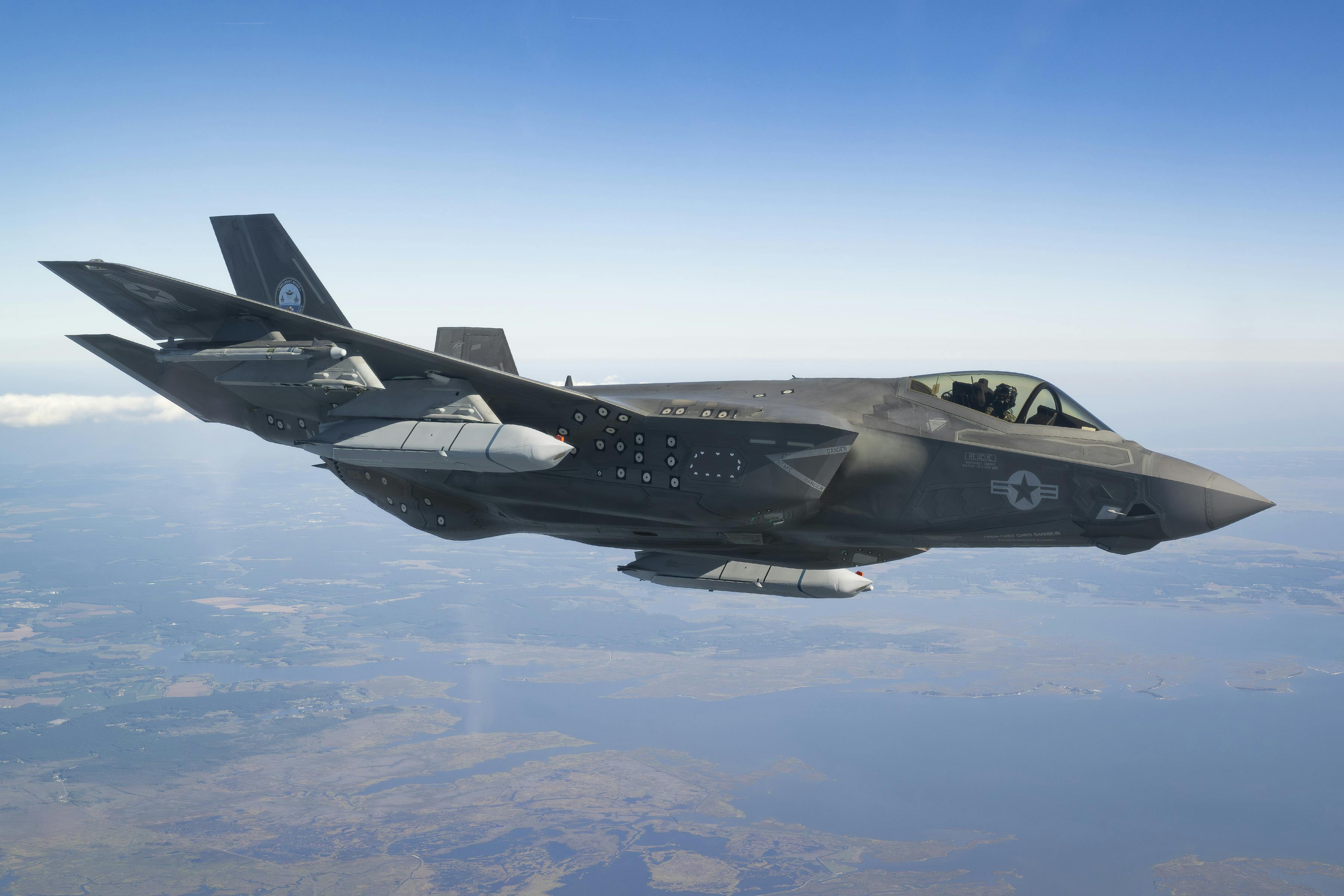 An F-35 Lightning II test pilot works to certify the carrier variant of the fighter aircraft for carrying the AGM-158C air-to-surface missile.