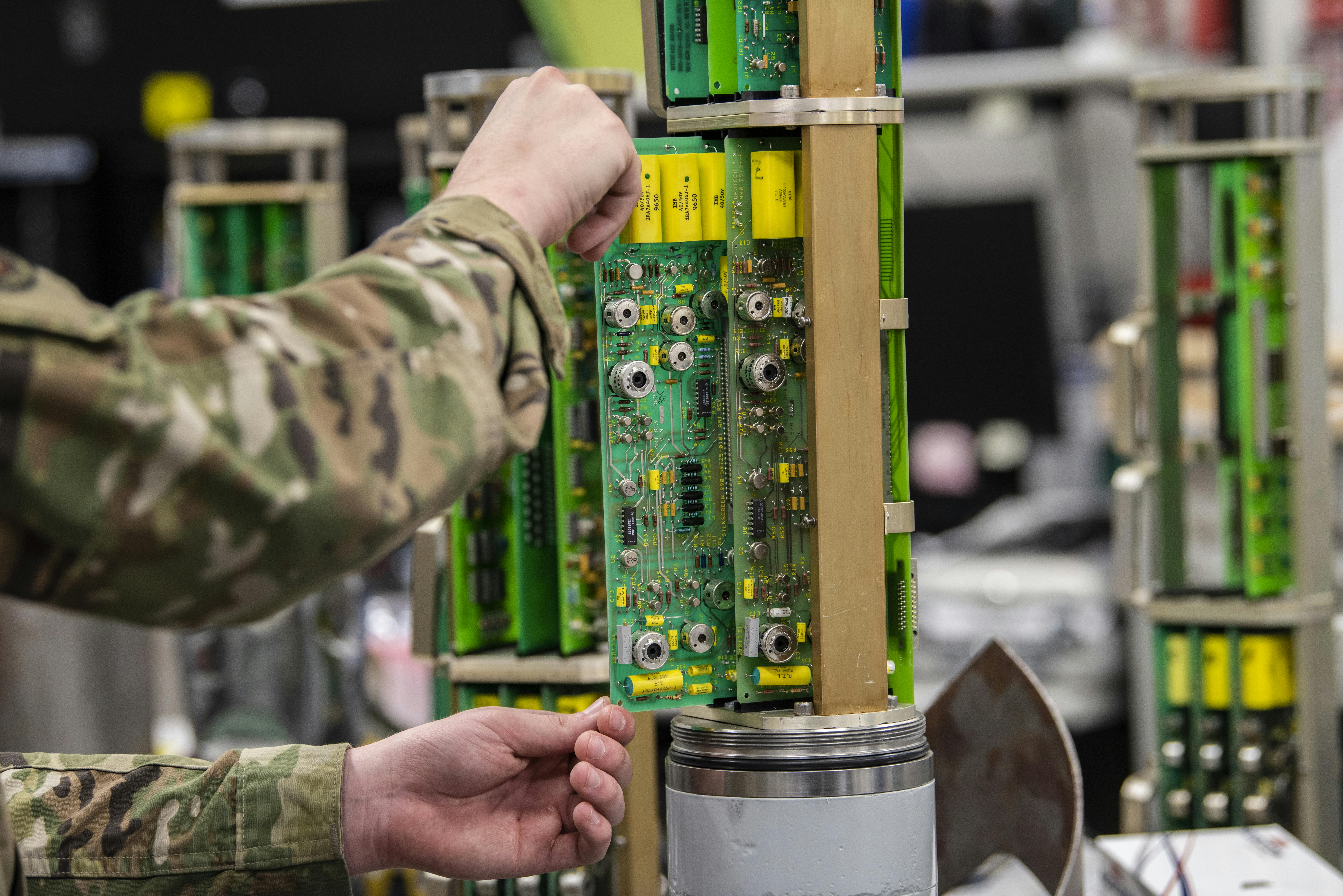 An Airman with the Air Force Technical Applications Center performs maintenance on a seismometer used to monitor seismic activity as a part of AFTAC global nuclear treaty monitoring.