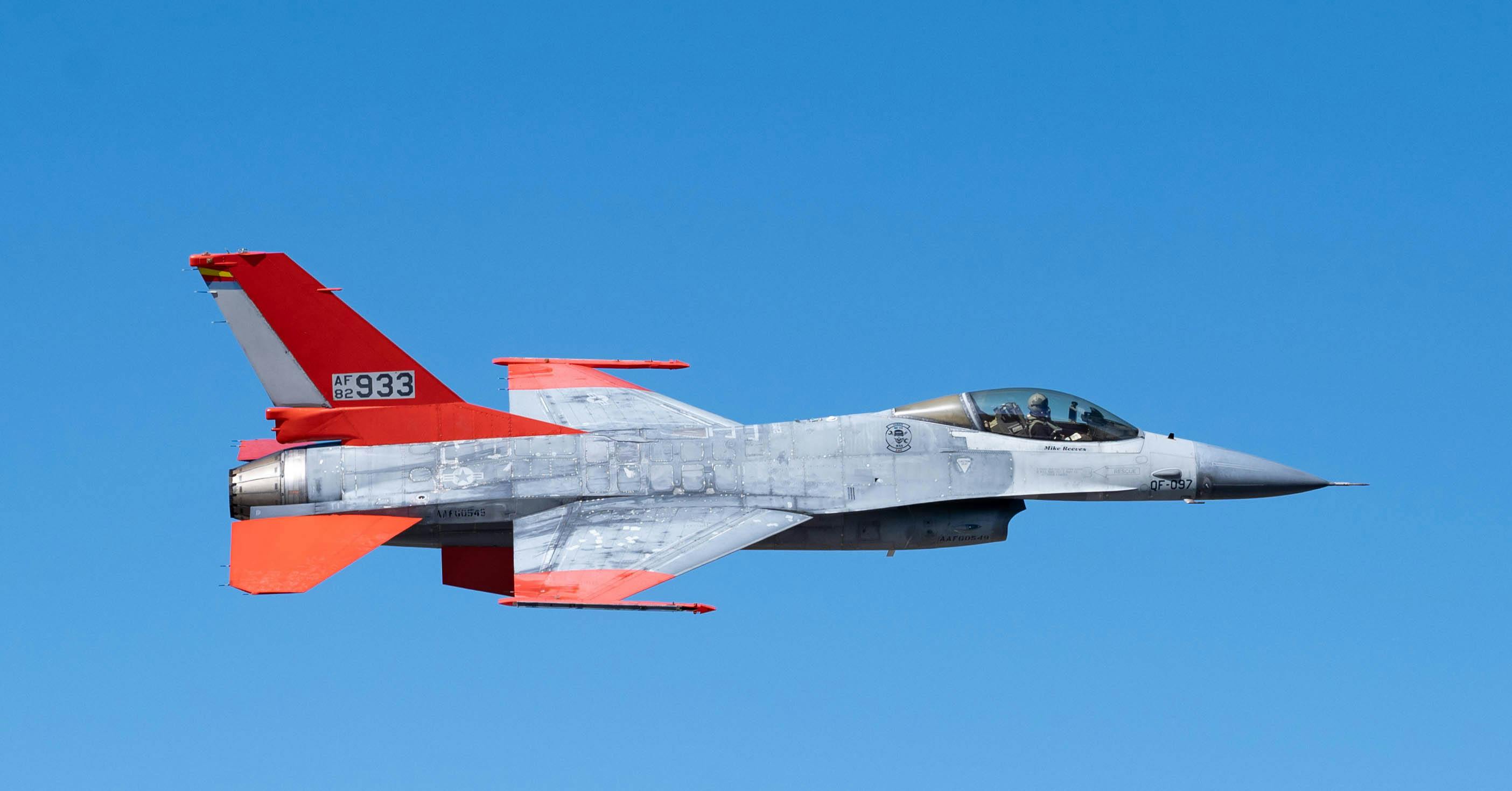 A QF-16 uncrewed aerial target departs following a test of a Bak-12 aircraft arresting system at MacDill Air Force Base, Fla.