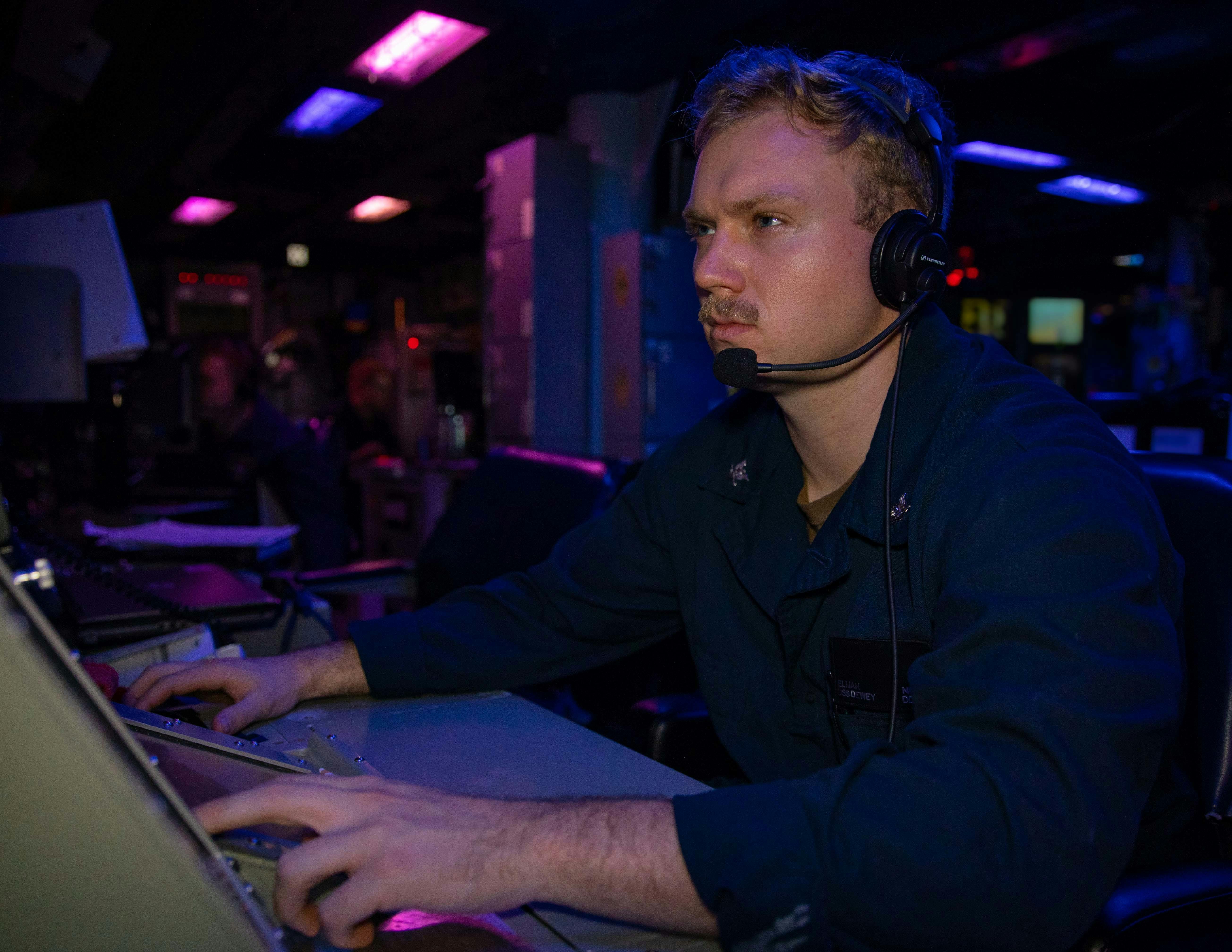 A Navy fire controlman stands the radar watch aboard the Burke-class guided-missile destroyer USS Dewey (DDG 105).