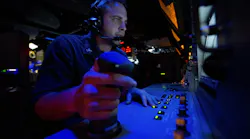 A Navy fire controlman stands watch in the combat information center aboard the guided-missile destroyer USS Arleigh Burke (DDG 51). A Navy fire controlman stands watch in the combat information center aboard the guided-missile destroyer USS Arleigh Burke (DDG 51).