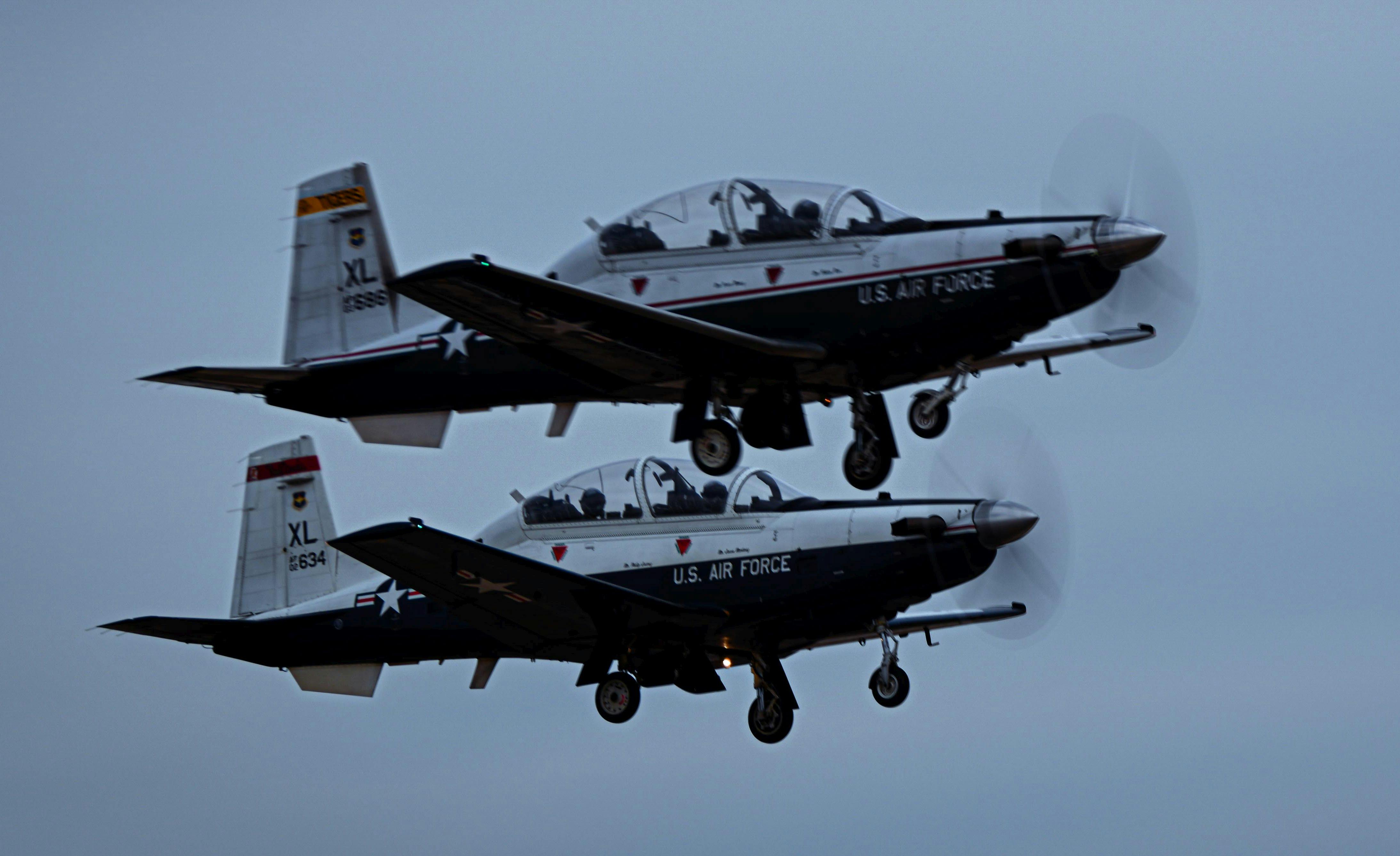 Two T-6A Texans take off from the runway at Laughlin Air Force Base earlier this year.