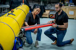 Naval Research Laboratory experts install newly developed payloads on one of the lab's Black Pearl uncrewed underwater vehicles. Naval Research Laboratory experts install newly developed payloads on one of the lab's Black Pearl uncrewed underwater vehicles.