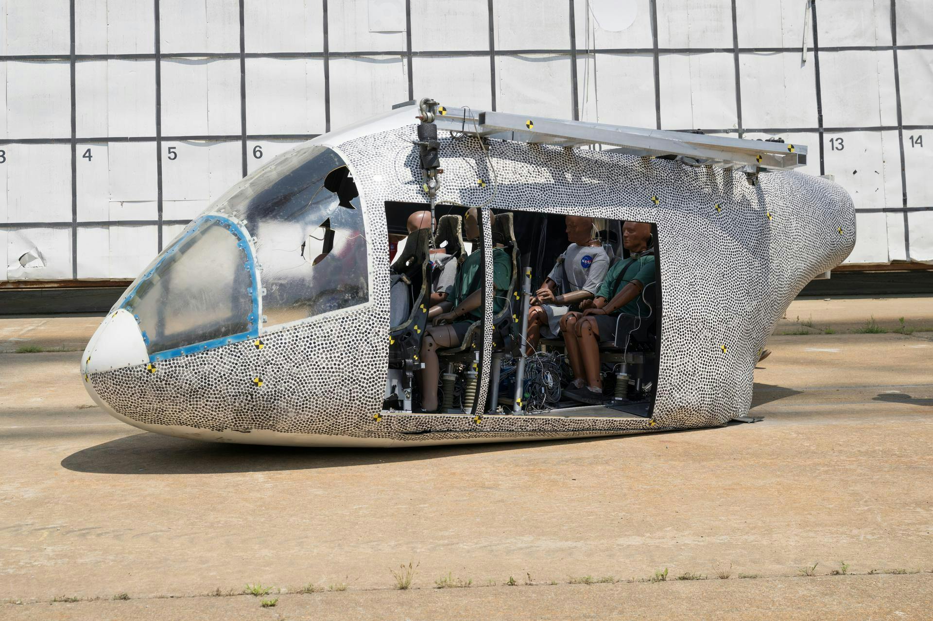 An aircraft body modeled after an air taxi with weighted test dummies inside is shown after a drop test at NASA&rsquo;s Langley Research Center in Hampton, Virginia. The test was completed June 26 at Langley&rsquo;s Landing and Impact Research Facility. The aircraft was dropped from a tall steel structure, known as a gantry, after being hoisted about 35 feet in the air by cables. NASA researchers are investigating aircraft materials that best absorb impact forces in a crash. NASA/Mark Knopp photo.