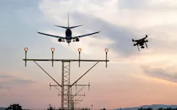 Drone flying at the airport near an aircraft leading to a possible crash or accident. Illegal UAV flight inside the airport conceptual montage Drone flying at the airport near an aircraft leading to a possible crash or accident. Illegal UAV flight inside the airport conceptual montage