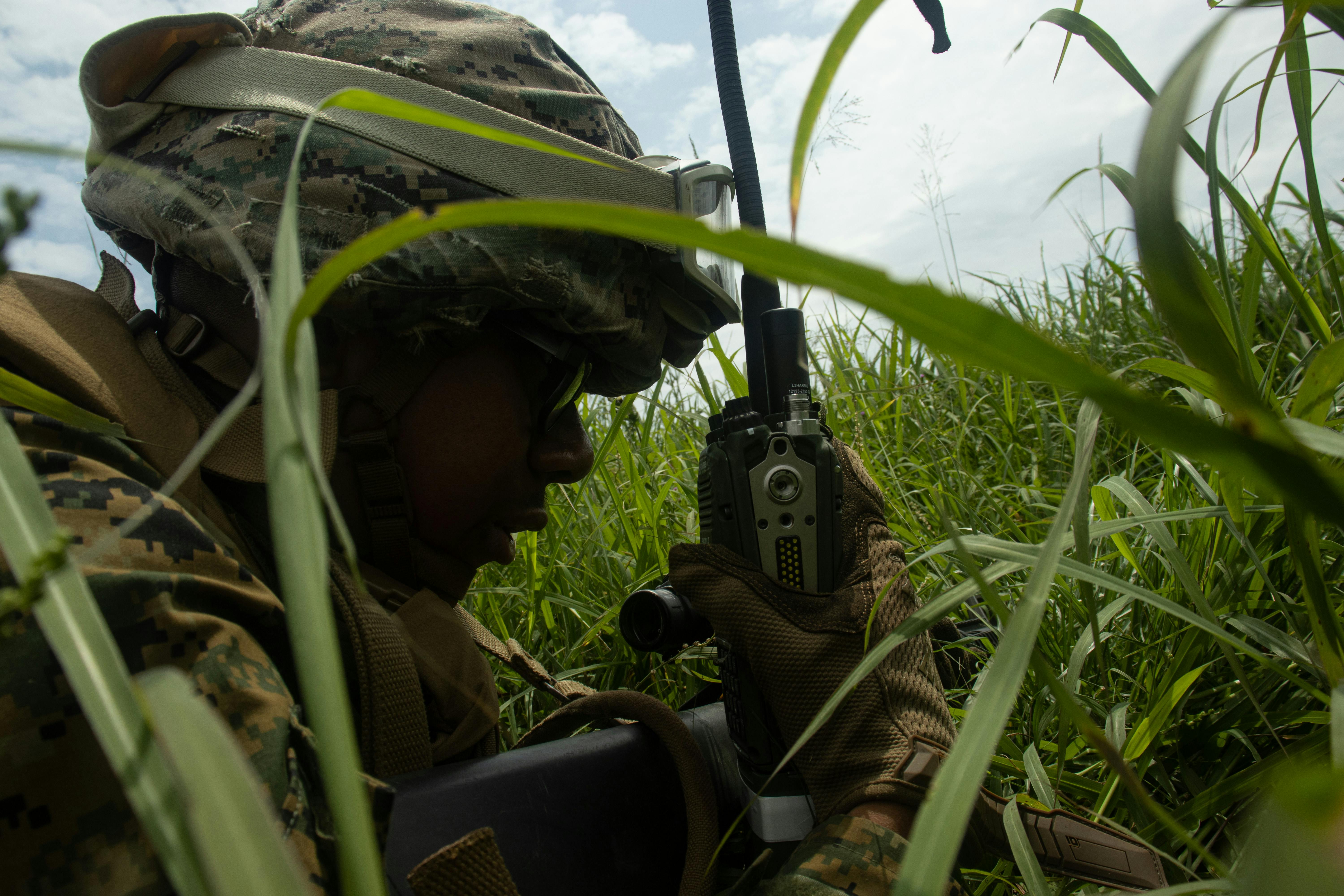 A U.S. Marine Corps expeditionary fuel technician establishes communications using a radio as part of an exercise at Ie Shima, Okinawa, Japan, last May.