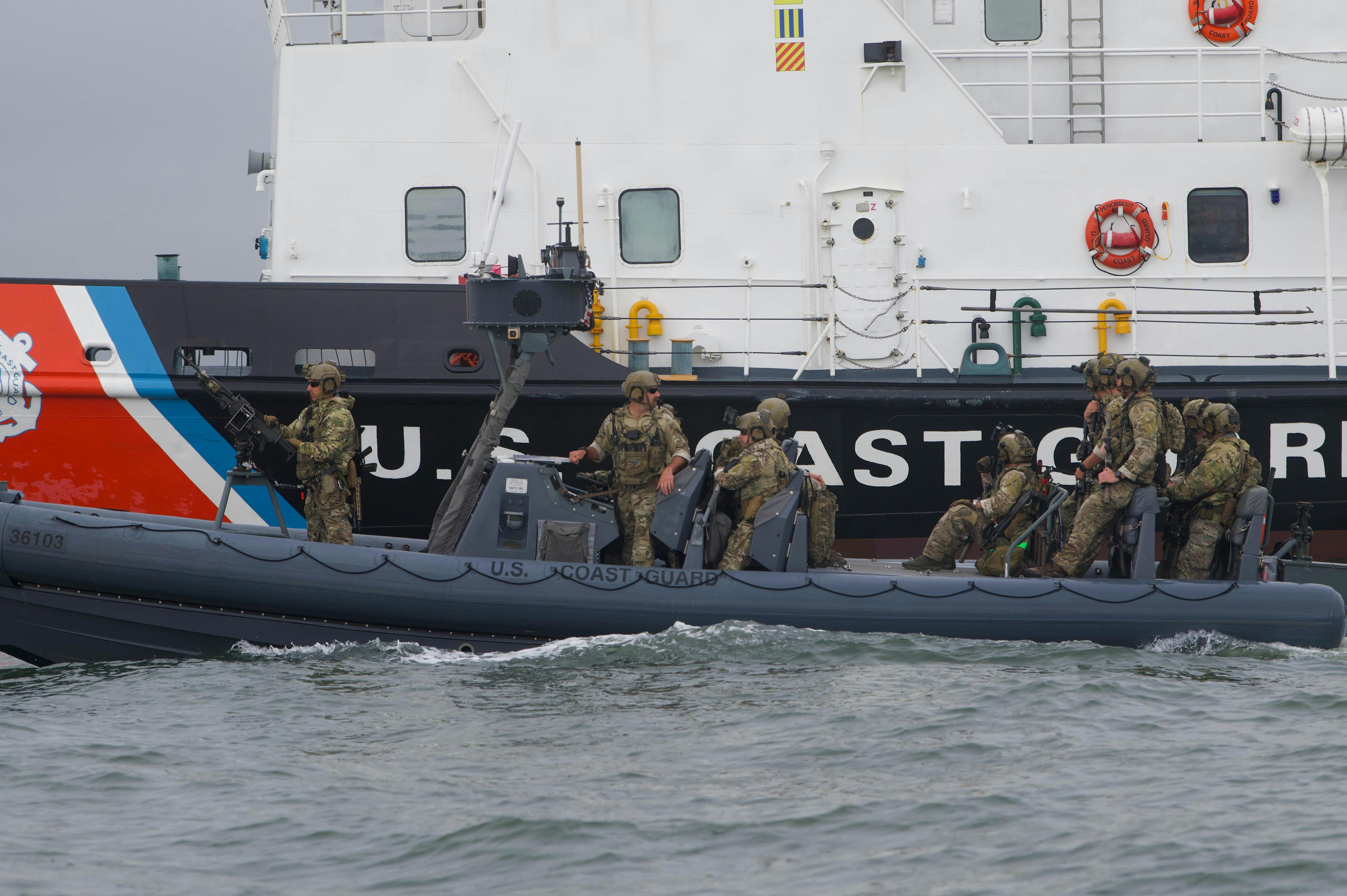 U.S. Coast Guard Maritime Security Response Team (MSRT) members stand guard aboard a rigid-hull inflatable boat (RHIB) alongside a Coast Guard cutter in New York Harbor last September.