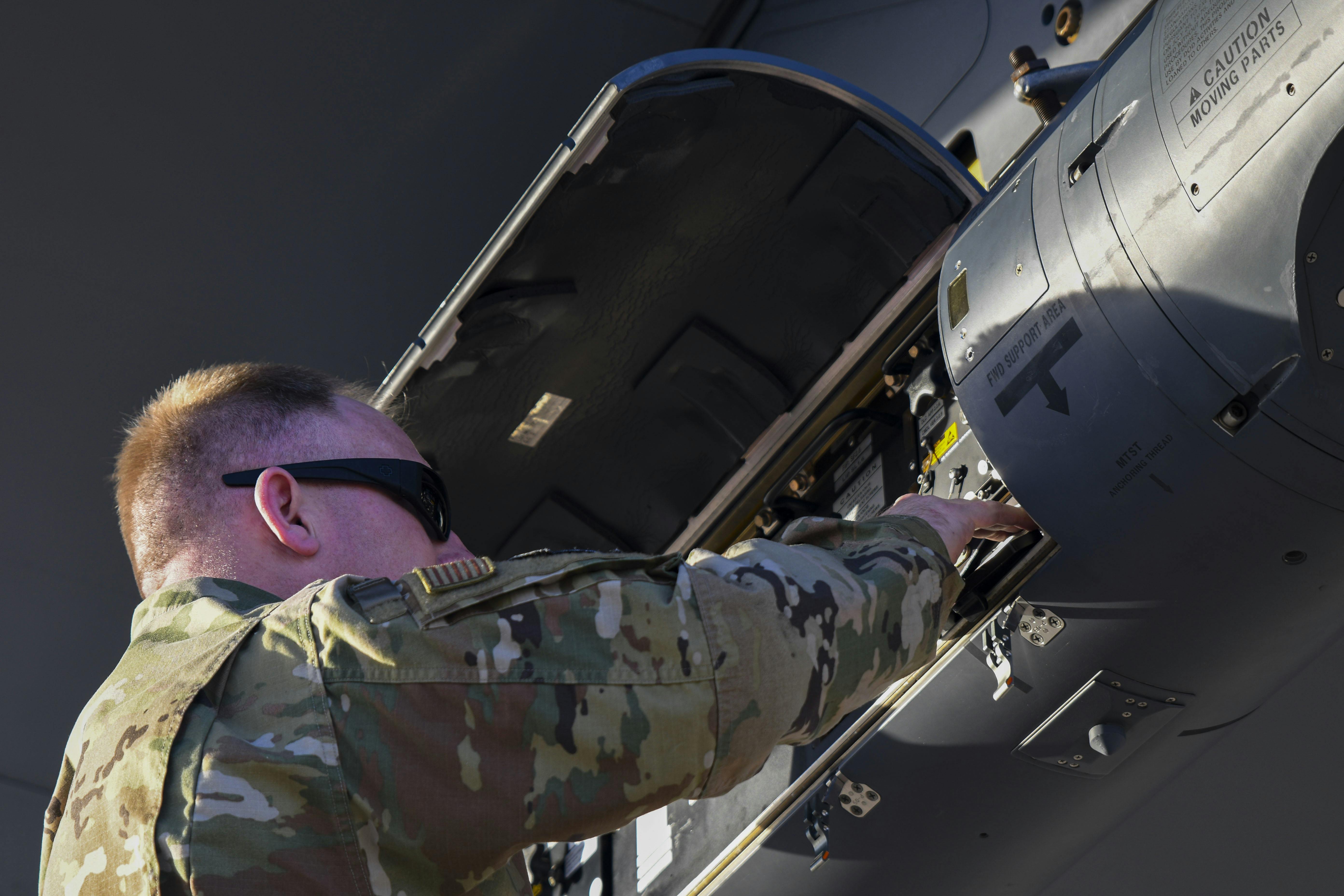An Air National Guard Air Force Reserve Command Test Center maintainer checks a LITENING targeting pod at Davis-Monthan Air Force Base, Ariz., in April 2021.