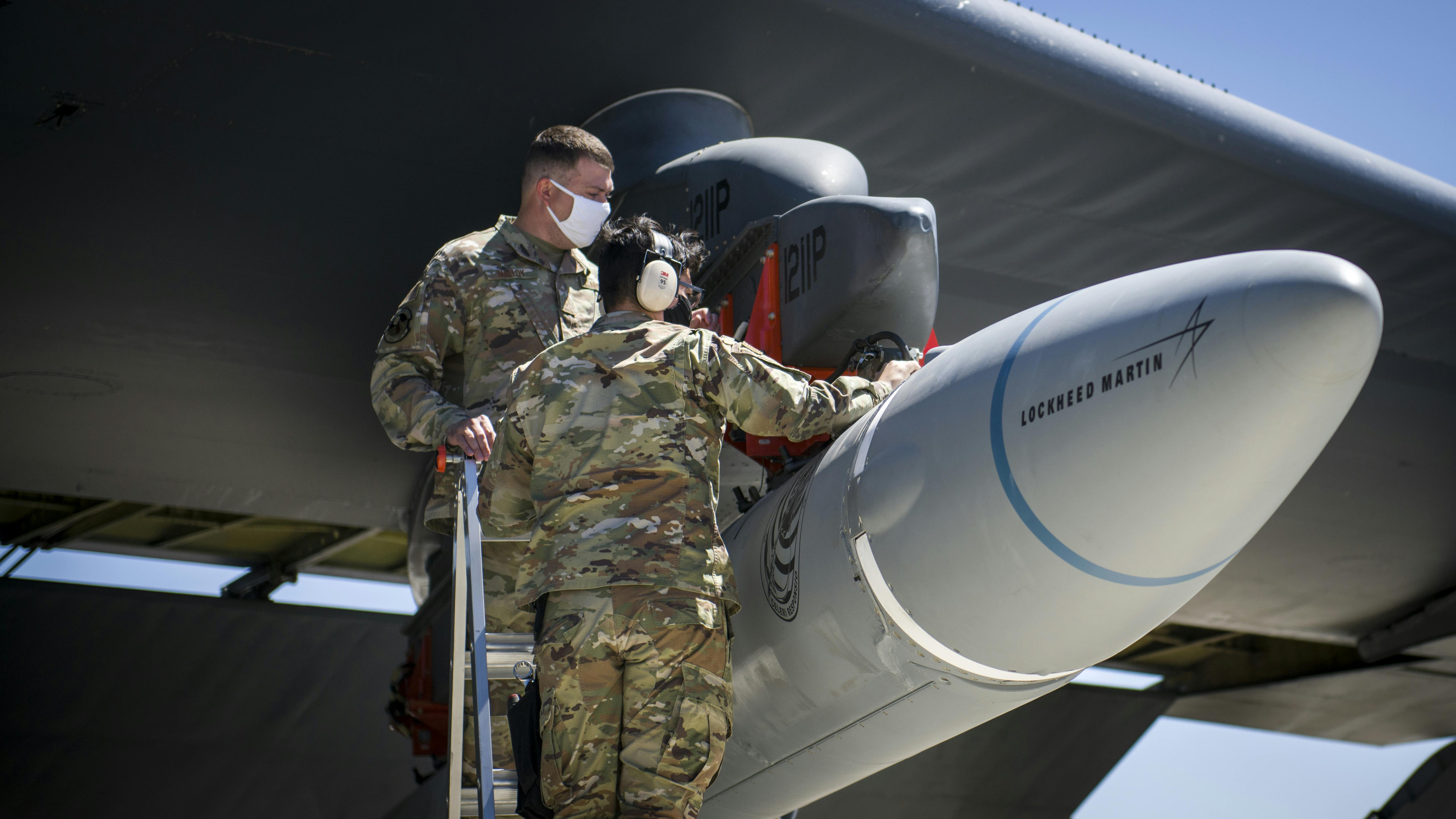 Air Force technicians secure the AGM-183A Air-launched Rapid Response Weapon Instrumented Measurement Vehicle 2 as it is loaded under the wing of a B-52H jet bomber at Edwards Air Force Base, Calif.