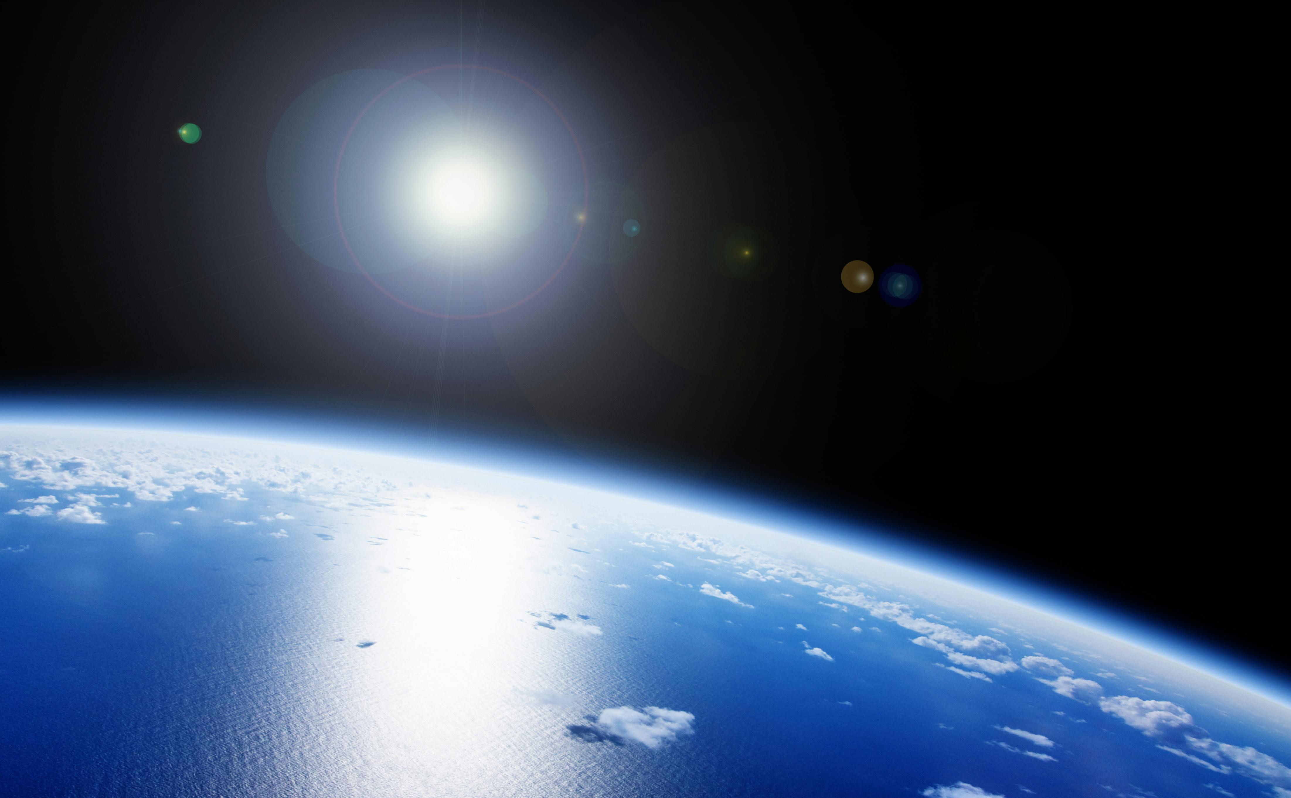 Earth and the Sun as seen from space.