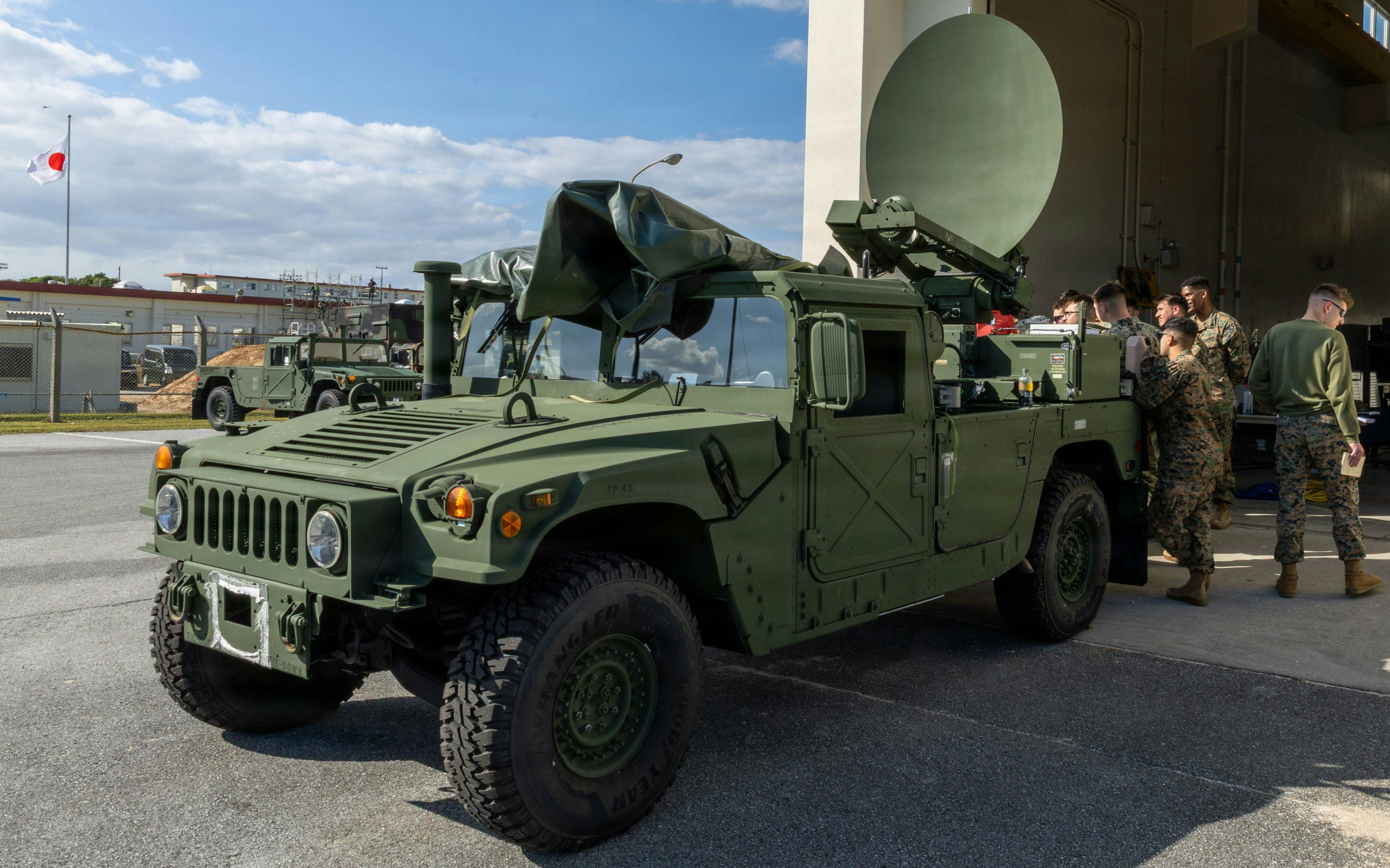 U.S. Marines operate a Secure, Mobile, Anti-jam, Reliable, Tactical-Terminal, a type of mobile satellite terminal, to establish point to point communication at Camp Hansen, Okinawa, Japan, last January.