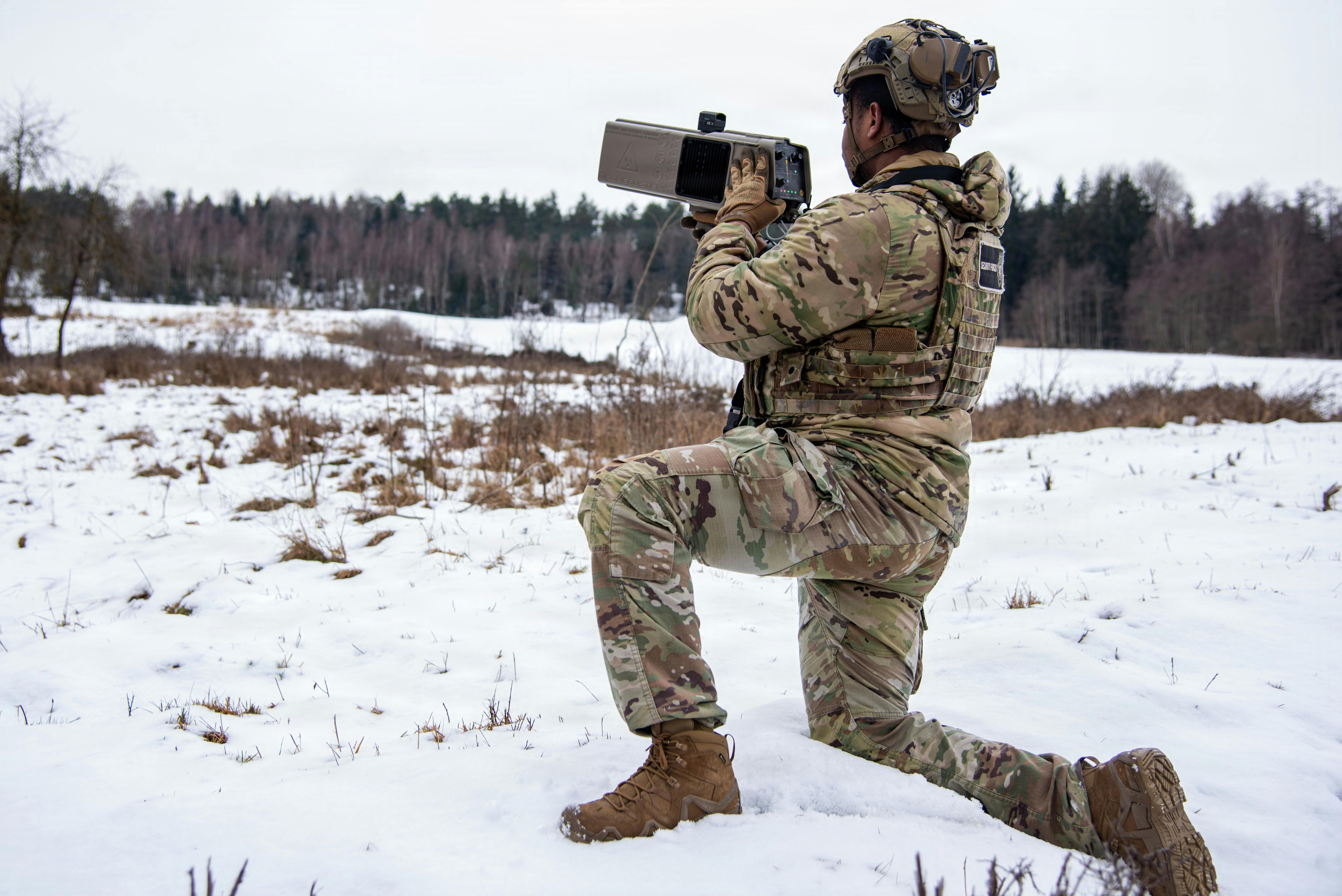 A U.S. Air Force security force specialist scans for drones with a Dronebuster during a patrol in the Grafenwoehr Training Area, Germany, last month.