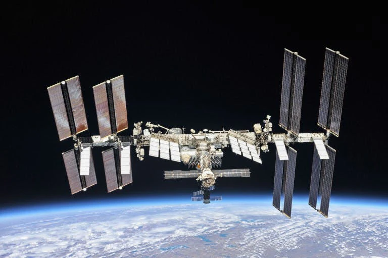 International Space Station is seen with Earth in the background.