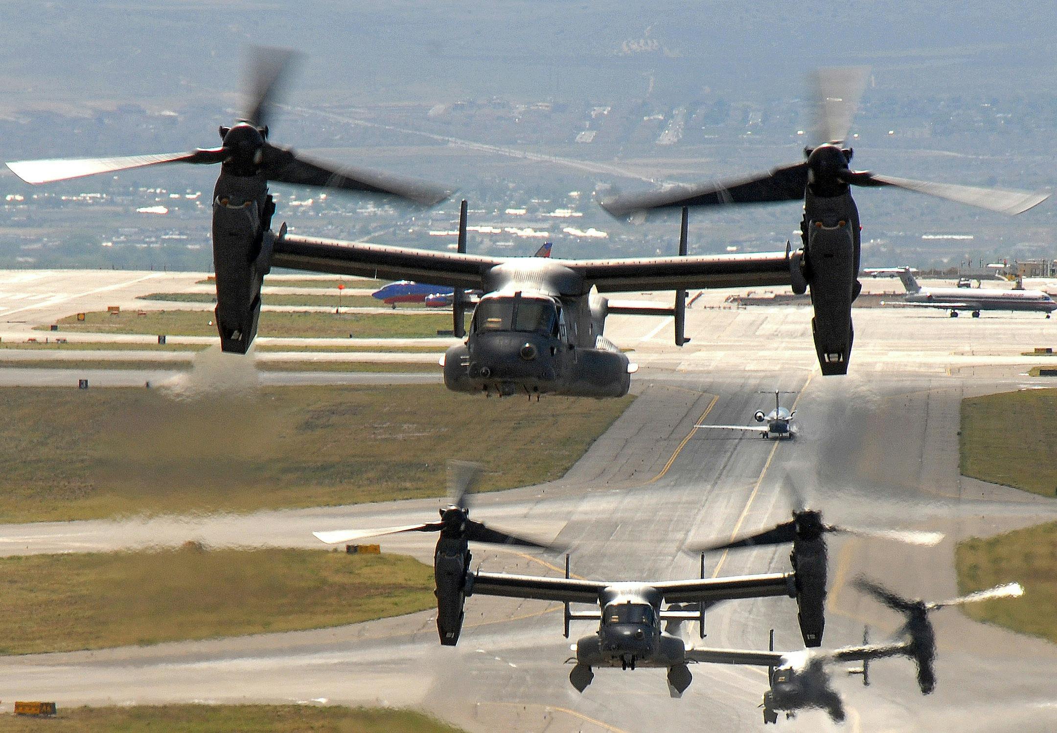 Air Force CV-22 Ospreys take off from a Kirtland Air Force Base, N.M. for a training mission. The Osprey is a tiltrotor aircraft that combines vertical takeoff, hover and landing qualities of a helicopter with the normal flight characteristics of a turboprop aircraft. U.S. Air Force photo/Staff Sgt. Markus Maier.
