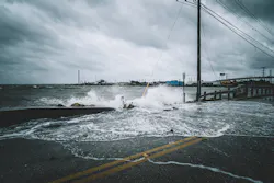 Hurricane washing water over road Hurricane washing water over road