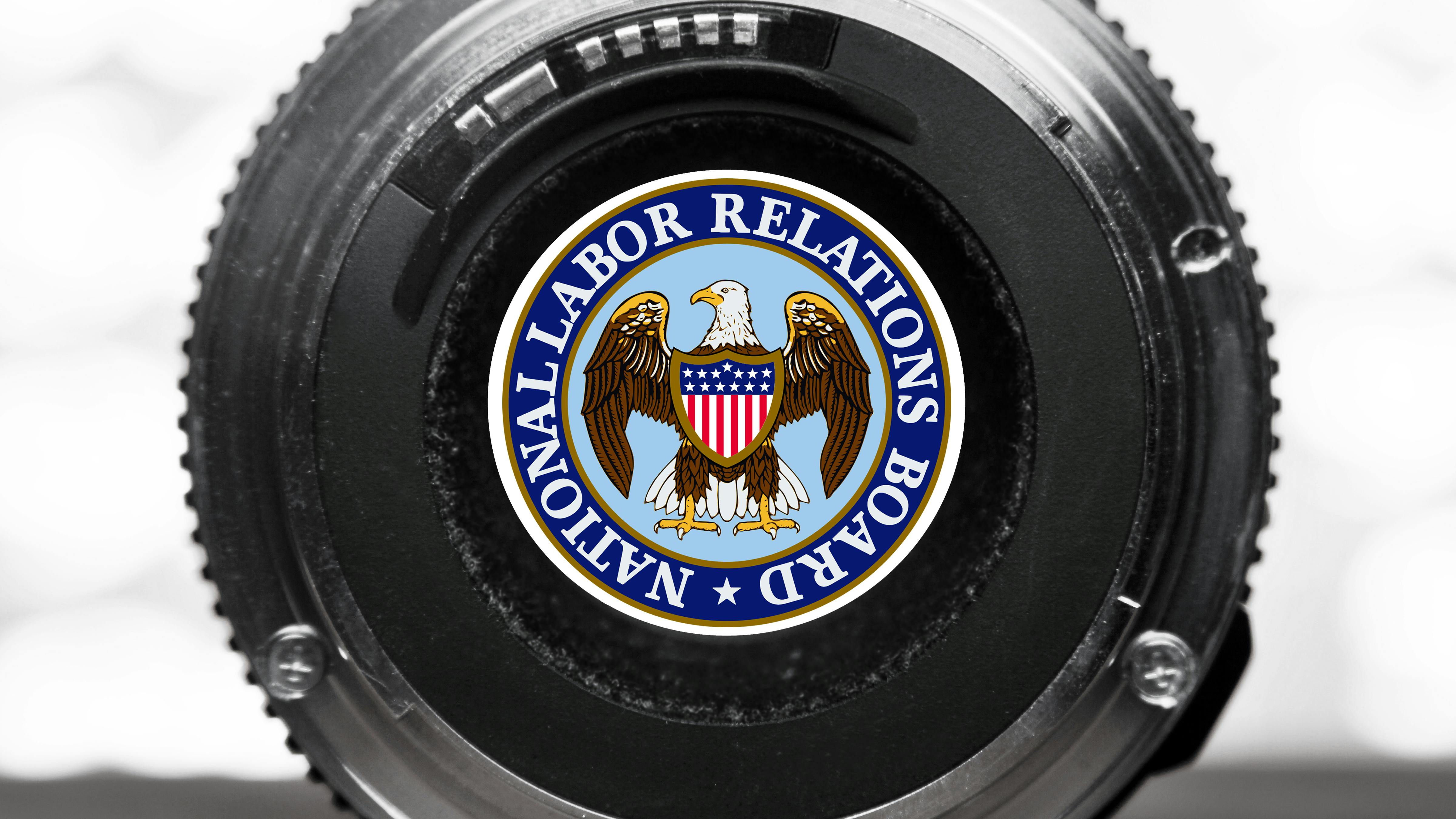 66db1cf77720520061e84625 Nlrb Logo In Camera Lens