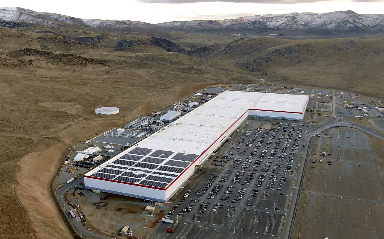 Aerial image several years ago of Tesla's gigafactory near Reno, Nevada. Image credit Smnt, own work, courtesy Wikimedia Commons.
