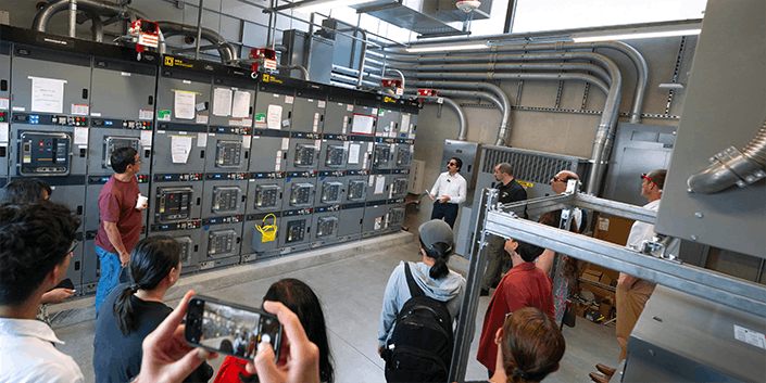 DERConnect project scientist Adil Khurram leads a tour of the new NSF-funded facility that is designed to allow researchers to test and explore hardware, software and controls technologies that will undergird the low-carbon electric grids of the future. (Photo credit: Erik Jepsen / UC San Diego)