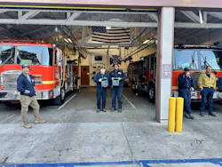 Topanga Station 49 firefighters holding solar-powered portable batteries. Image courtesy Footprint Project Topanga Station 49 firefighters holding solar-powered portable batteries. Image courtesy Footprint Project