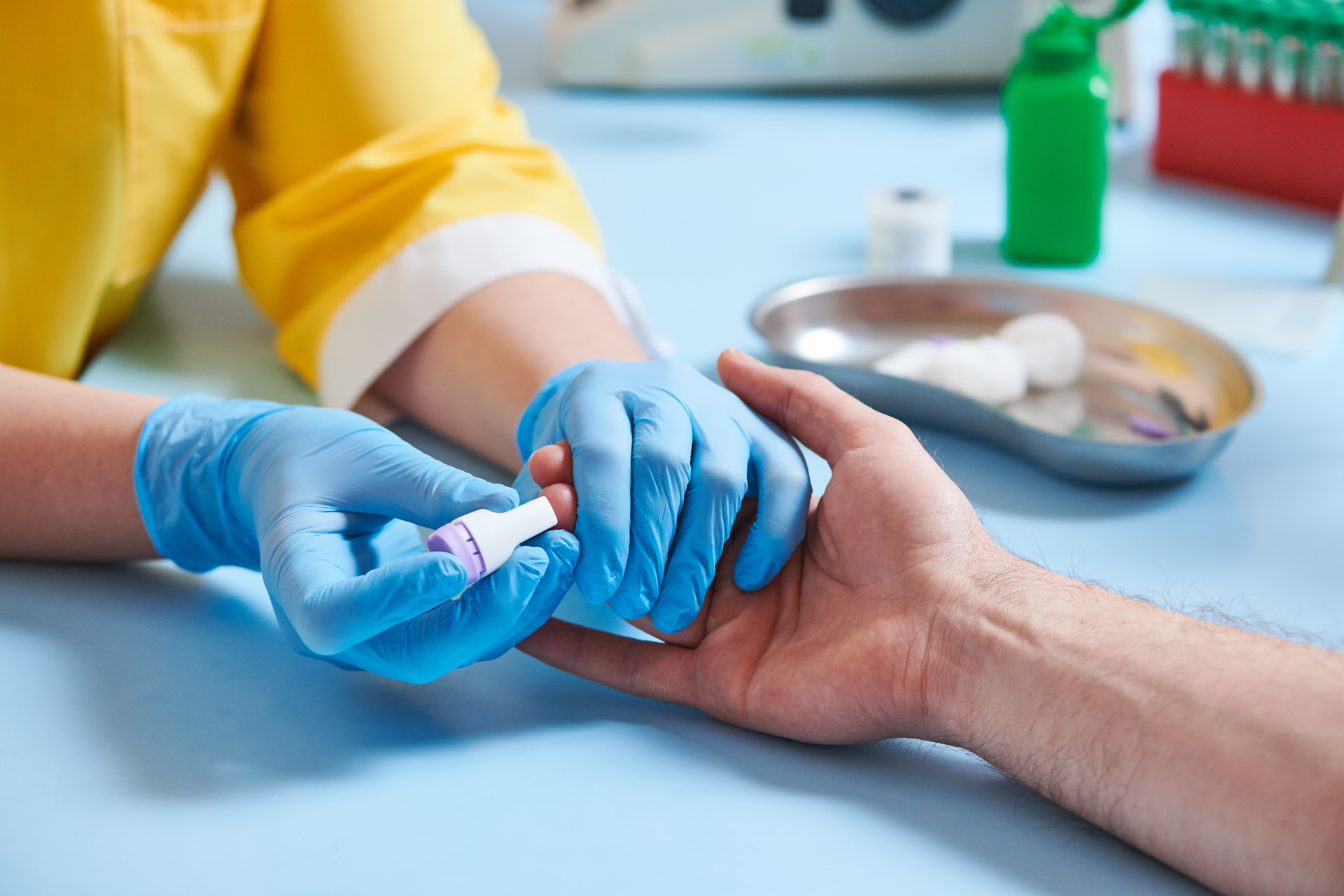 Blood test. Medicine. Piercing male finger for blood examitation analysis.