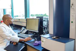 Figure 1. Bacterial identification by MALDI-TOF. A laboratory technologist is analyzing clinical samples using a MALDI-TOF mass spectrometer. The bacterial protein profile spectrum for a sample is shown on the computer screen. The MALDI-TOF instrument is on the right (Photo courtesy of the Biomedical Laboratory Diagnostics Program at Michigan State University). Figure 1. Bacterial identification by MALDI-TOF. A laboratory technologist is analyzing clinical samples using a MALDI-TOF mass spectrometer. The bacterial protein profile spectrum for a sample is shown on the computer screen. The MALDI-TOF instrument is on the right (Photo courtesy of the Biomedical Laboratory Diagnostics Program at Michigan State University).