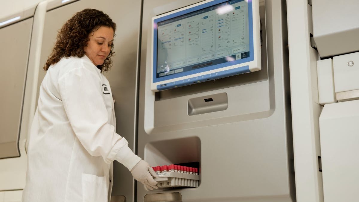 67ed45f5706101901d51e2eb 02 Lab Tech Puttingtrayinsystem3