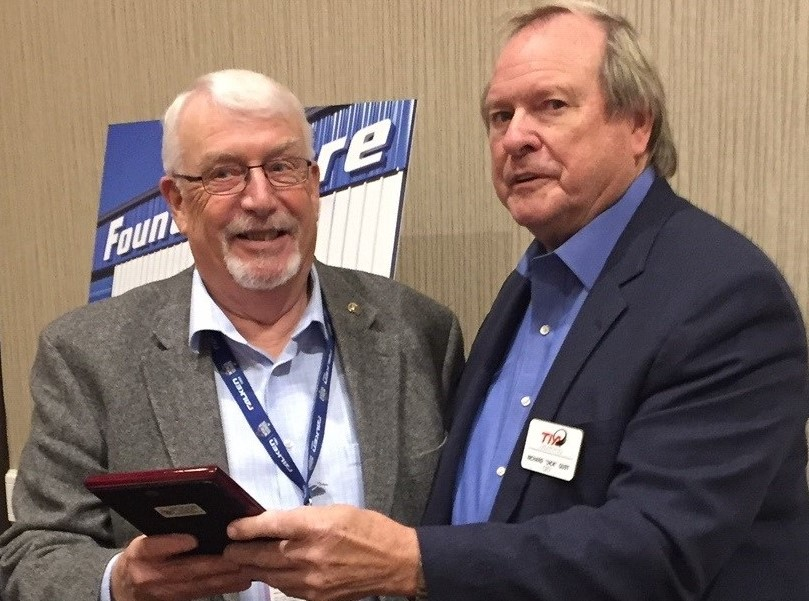 Dick Nordness (left), longtime executive director of the Northwest Tire Dealers Association, received a lifetime achievement award from the Tire Industry Association, presented by TIA CEO Dick Gust.